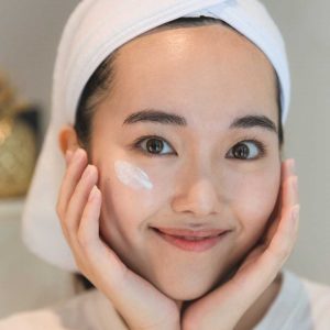 Person with sunscreen applied on face